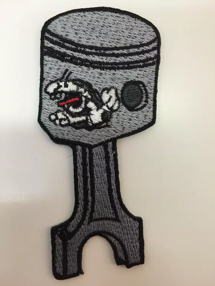 Kangasmerkki, Piston - Kangasmerkit - K1094 - 1